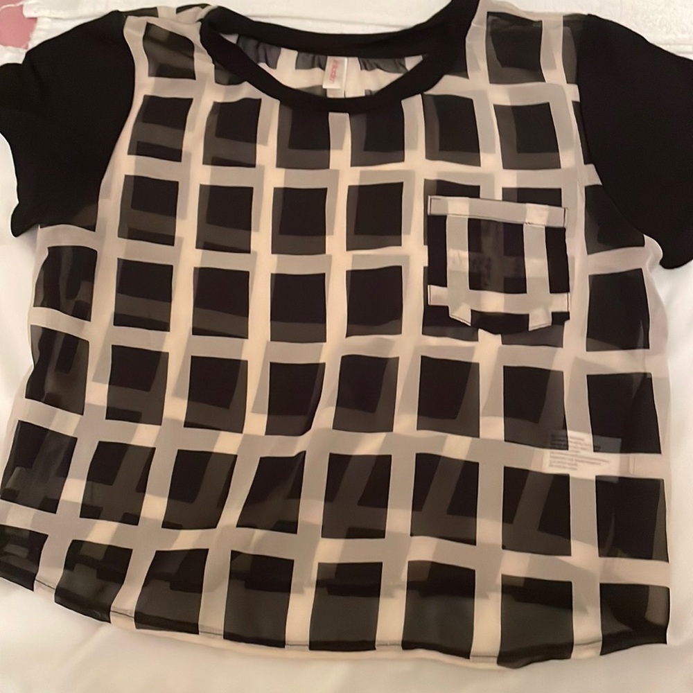 Xhilaration women’s size small sheer crop top with front pocket and cap sleeve.
